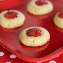These flavorful Pepper Jelly Cornmeal Thumbprint Cookies will surprise you with their soft cornmeal crumb and spicy, sweet filling. Spice things up this holiday season!